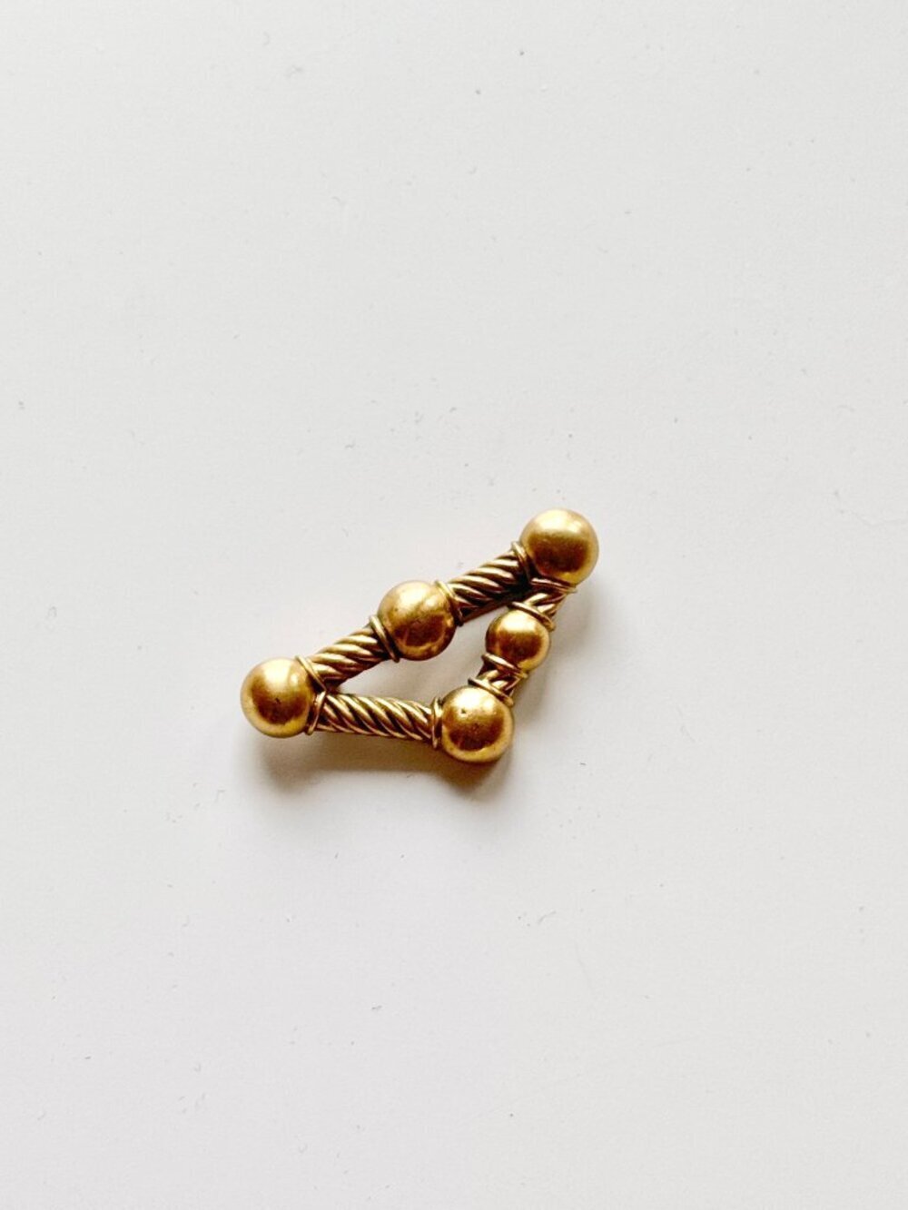 MUSEUM REPRODUCTIONS Modernist Gold Tone Rope Triangle Brooch